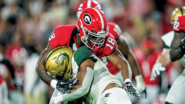 Georgia Bulldogs linebacker Xavian Sorey Jr. tackles UAB Blazers running back Isaiah Jacobs during the second half at Sanford Stadium.